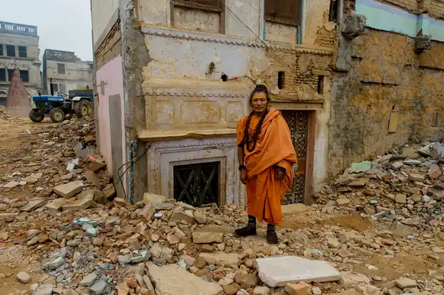 Swami Kailash Bharti stands in front of his ashram which he vows not to surrender.