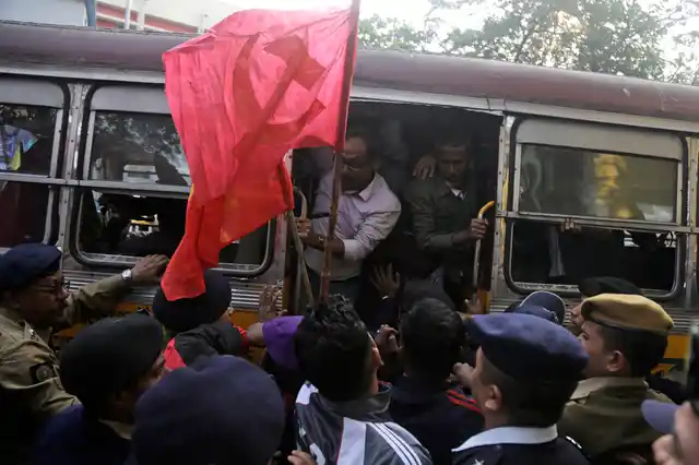 Trade union activists are detained during a demonstration on the first day of a two-day general strike called by various trade unions in Kolkata on Tuesday, 8 January. 