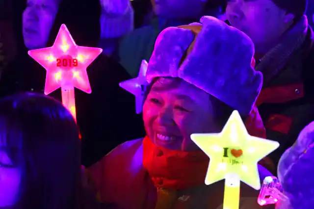 A reveller prepares to countdown to the new year in Beijing, China on 31 December 2018. 
