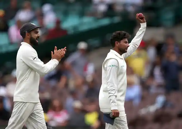 Kuldeep Yadav celebrates after finishing with career-best figures of 5/99 in the Sydney Test.