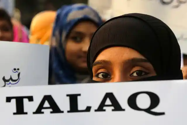 A Muslim woman holds a placard in Kolkata that reads ‘Talaq’, meaning ‘divorce’, during a protest against India’s Parliament’s move to approve a bill to implement the Supreme Court’s ruling that found the Muslim practice of instant divorce was unconstitutional, on Thursday, 10 January, 2019.