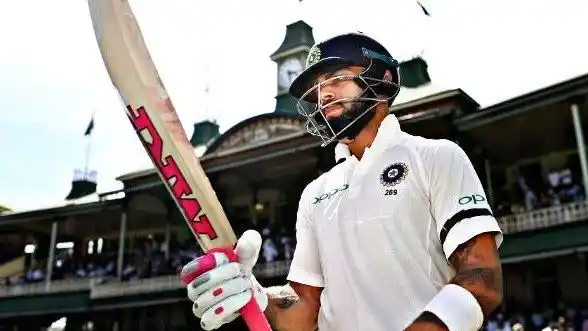 Viral Kohli brandishing his pink grip bat.