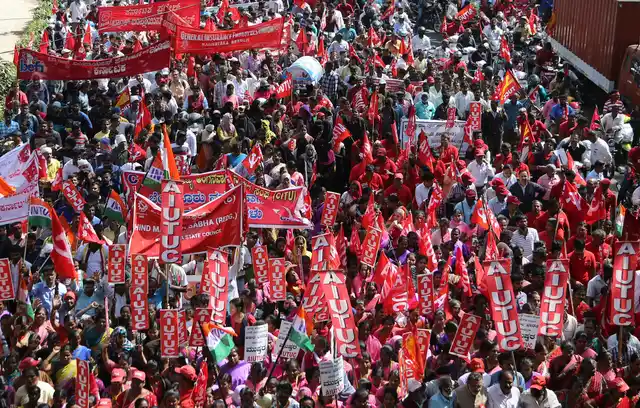 Indian trade union activists participate in a demonstration on the first day of a two-day long nationwide general strike called by various trade unions in Bengaluru, India.
