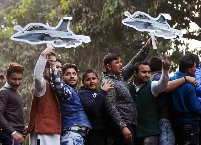 Youth Congress activists hold cutouts of Rafale fighter planes during a protest against the Rafale deal issue, in New Delhi, on Thursday, 3 January. The Opposition and the government were involved in a bitter war of words on the Rafale issue in Lok Sabha on Wednesday.