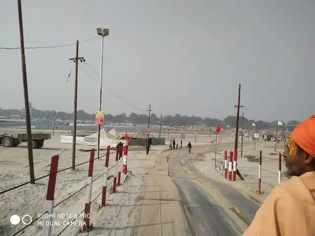 A man overlooks the empty mela ground. 