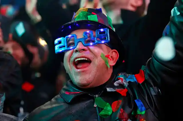 A reveler celebrates as confetti falls during a New Year’s celebration in New York’s Times Square on 1 January 2019. 