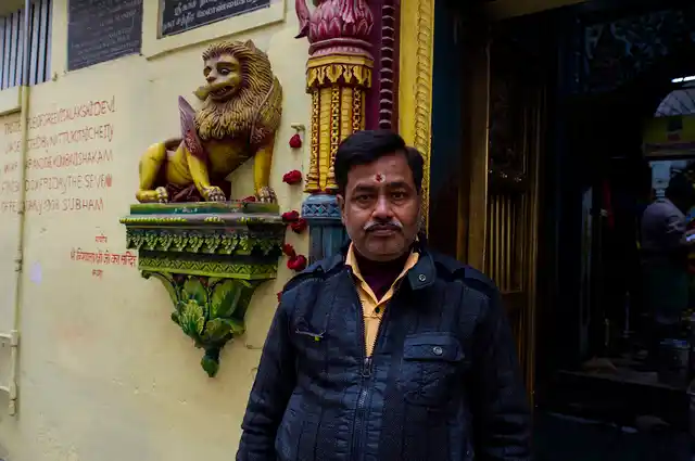 Rajnath Tiwari, president of the now-defunct Dharohara Bachao Sangharsh Samiti, Kashi poses in front of the Vishalakshi temple.