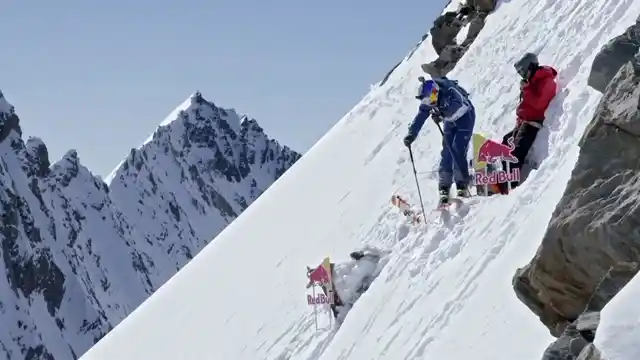 The two skiiers on a mountain slope.