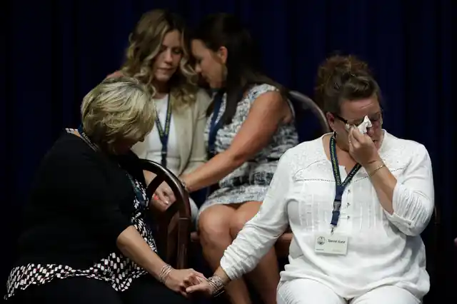 Victims of clergy sexual abuse, or their family members, react after a news conference at the State Capitol in Harrisburg, US.