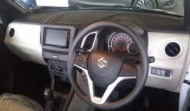 The interiors of the 2019 Maruti Wagon-R are in light beige and black.