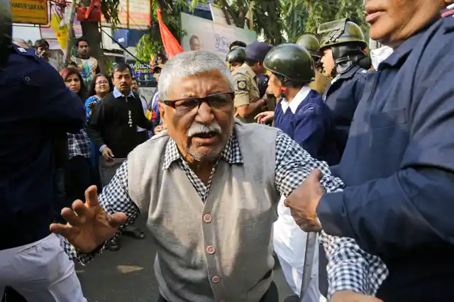 Policemen detain an elderly activist of the Communist Party of India-Marxist (CPI-M) during a rally on the second day of a two-day general strike called by various trade unions in Kolkata, on Wednesday, 9 January 2019. The strike had been called against the government’s alleged anti-worker policies and unilateral labour reforms.