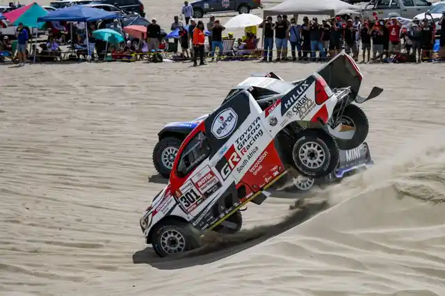 Two cars battle it out soon after taking off from the starting line.