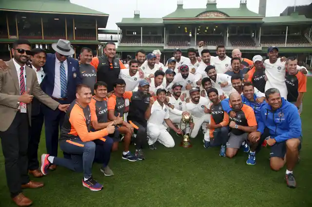 The Indian cricket team and support staff celebrate their series win over Australia after play was called off on day 5 of their cricket test match in Sydney, Monday, Jan. 7, 2019. The match is a draw and India wins the series 2-1.