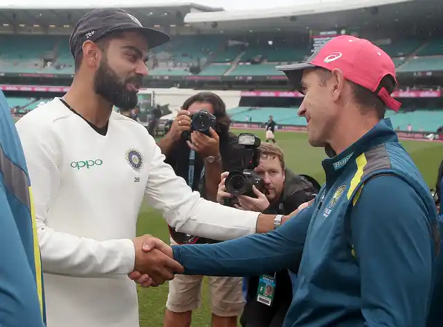 India’s captain Virat Kohli, left, shakes hands with Australia’s coach Justin Langer after India’s series win after play was called off on day 5 of their cricket test match in Sydney, Monday, Jan. 7, 2019. The match is a draw and India wins the series 2-1.