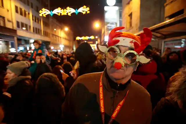 Bosnian people cheer during New Year’s celebrations in Sarajevo, Bosnia on Tuesday, 1 January 2019. 