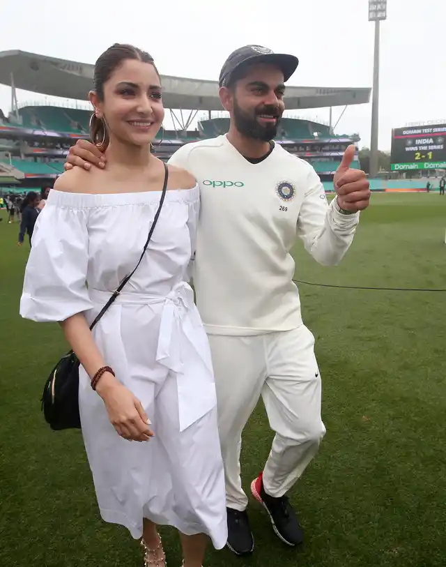 India’s cricket captain Virat Kohli, right, walks with his wife, Anushka Sharma celebrates India’s series win over Australia after play was called off on day 5 of their cricket test match in Sydney, Monday, Jan. 7, 2019. The match is a draw and India wins the series 2-1.