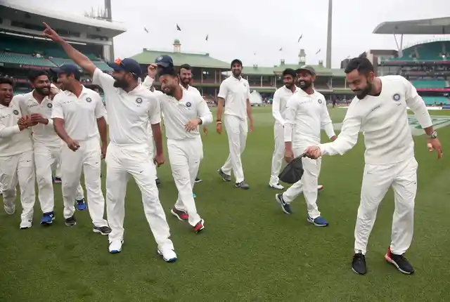 India’s Virat Kohli, right, tips his hat as he celebrate with teammates their series win over Australia after play was called off on day 5 of their cricket test match in Sydney, Monday, Jan. 7, 2019. The match is a draw and India wins the series 2-1.
