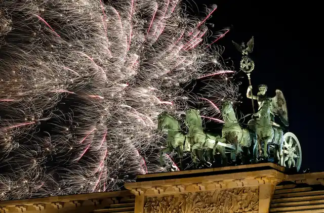 Fireworks light the sky above the Quadriga at the Brandenburg Gate shortly after midnight in Berlin, Germany on 1 January 2019. Hundred thousands of people celebrated New Year’s Eve welcoming the new year 2019 in Germany’s capital. 