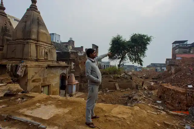 Prabhu Singh points towards his house that he refuses to part with unless he gets the amount he wants as compensation.