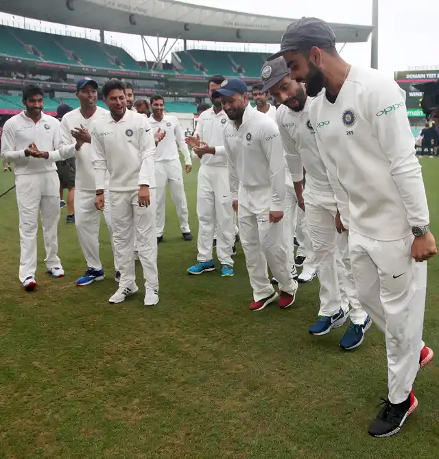 India’s Virat Kohli, right, leads his team in a dance as they celebrate their series win over Australia after play was called off on day 5 of their cricket test match in Sydney, Monday, Jan. 7, 2019. The match is a draw and India wins the series 2-1. 