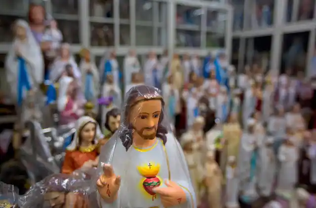 In this Saturday, 3 November, 2018, photo, Catholic statues are seen for sale in a shop next to a Church in Kottayam.