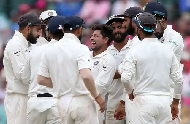 India’s Kuldeep Yadav, center, celebrates with teammates after taking the wicket of Australia’s Tim Paine on day 3 of their cricket test match in Sydney, Saturday, Jan. 5, 2019.