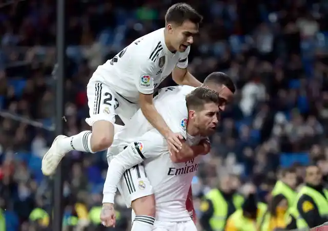 Real Madrid’s Sergio Ramos, bottom, celebrates with teammates after scoring a penalty during a Spanish Copa del Rey soccer match.