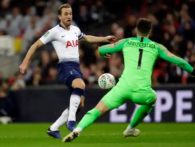 Tottenham’s Harry Kane, left, faces Chelsea’s goalkeeper Kepa Arrizabalaga during the English League Cup semi-final first leg soccer match.