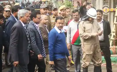 New Delhi: Delhi Chief Minister Arvind Kejriwal visit the site where a child and 16 others, including a woman was killed in a major fire that engulfed several storeys of a central Delhi hotel on Feb. 12, 2019.(Photo: IANS)