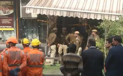New Delhi: Fire fighters and NDRF personnel outside Hotel Arpit Palace in Karol Bagh where a major fire broke out killing seventeen people, including a child and injuring three others in New Delhi on Feb 12, 2019. (Photo: IANS)