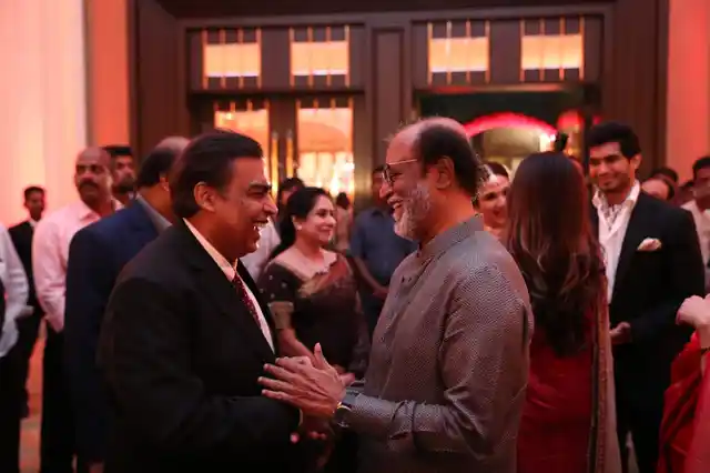 Mukesh Ambani and Rajinikanth share a light moment.