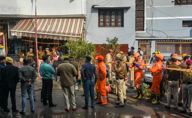 NDRF, firefighters and police officials seen at the site after a massive fire broke out at Karol Bagh’s Arpit Palace hotel, in which at least 17 people were killed and several injured in New Delhi.