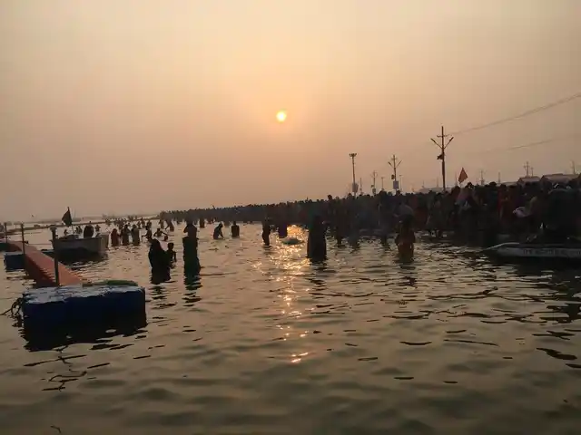 Devotees take a dip in river Ganga in Kumbh mela.
