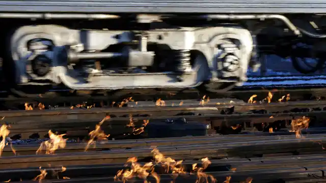 A Metra train moves southbound to downtown Chicago as the gas-fired switch heater on the rails keeps the ice and snow off the switches near Metra Western Avenue station in Chicago, Tuesday, 29 January 2019. Forecasters warn that the freezing weather Tuesday will get worse and could be life-threatening.