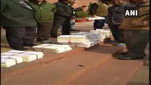 Copies of the CAG report on Rafale seen outside the Parliament earlier in the day.