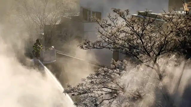 New York firefighters battle a blaze in a commercial building in the Bedford Stuyvesant neighbourhood of Brooklyn, Thursday, 31 January 2019 in New York. Firefighters around New York state have been grappling with brutal cold during big blazes.