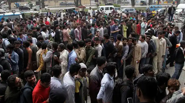 A 2017 picture of crowds collecting outside the stadium for a PSL match.