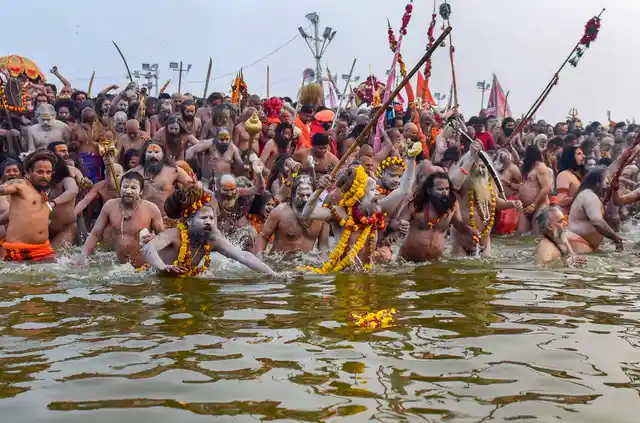 Sadhus take a dip in the on the auspicious Mauni Amavasya during the Kumbh Mela 2019, in Prayagraj on 4 February.