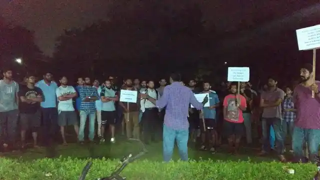 Research scholars gather to protest. 