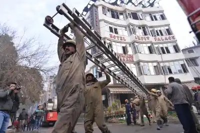 New Delhi: Fire service officials try to douse fire at Arpit Palace Hotel in Karol Bagh, New Delhi on Feb. 12, 2019. A child and 16 others, including a woman was killed in a major fire that engulfed several storeys of this central Delhi hotel. (Photo: IANS)