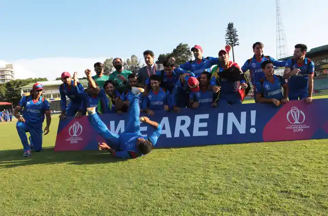 Afghanistan players celebrate after beating Ireland to qualify for the Cricket World Cup after their match at Harare Sports Club, Friday, March, 23, 2018.