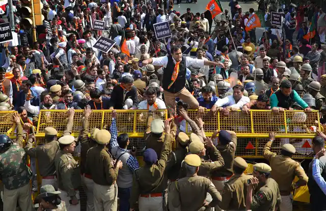 Bharatiya Janata Party workers and leaders stage a protest during Jail Bharo movement near Civil Lines railway crossing in Jaipur on 8 February.