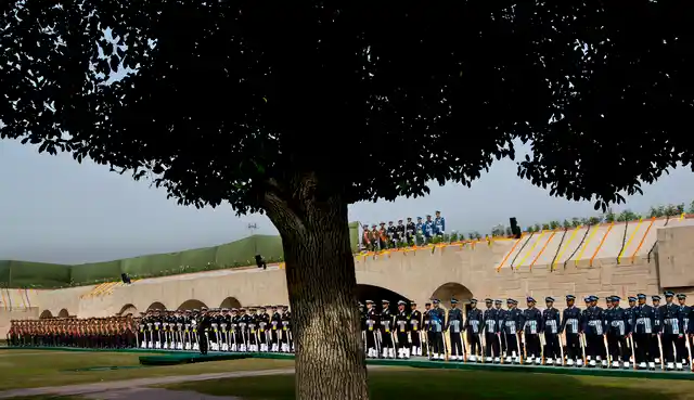 Indian soldiers pay their tributes to Mahatma Gandhi, on his death anniversary at the Rajghat, in New Delhi, Wednesday, 30 January.