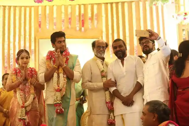 Tamil choreographer and actor Raghava Lawrence takes a selfie with the Superstar and the couple.
