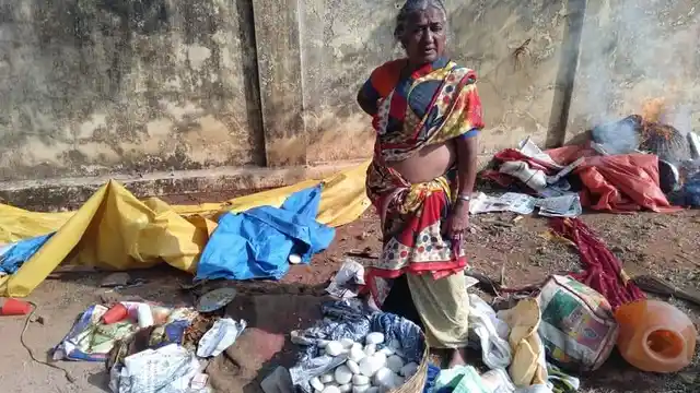 Shamim standing in the remains of her food stall.