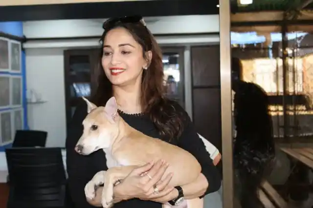 Madhuri poses with the new member.
