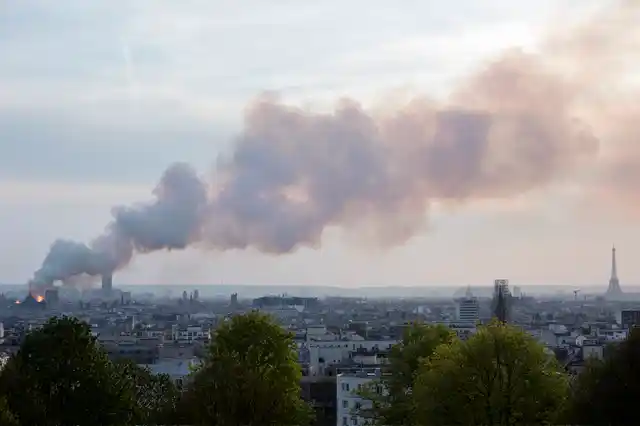 Smoke fill the air as Notre Dame cathedral is burning in Paris on 15 April.