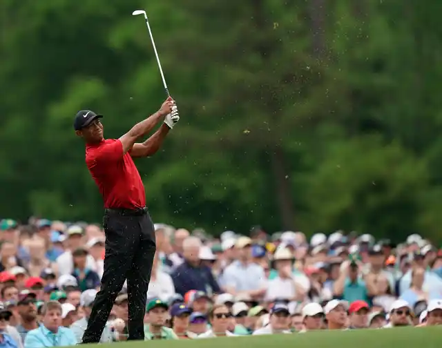 Tiger Woods hits on the 12th hole during the final round for the Masters golf tournament.