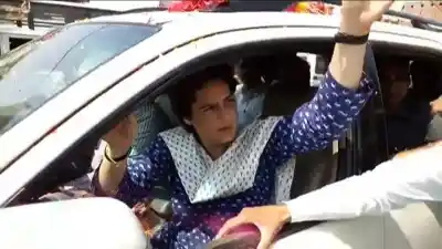 Amethi (UP): Congress General Secretary Priyanka Gandhi Vadra greets supporters on her arrival in Amethi, Uttar Pradesh on April 19, 2019. She will hold a party workers meeting in Gauriganj, the district headquarters of Amethi, on Friday ahead of her roadshow in Kanpur later in the day. (Photo: IANS)