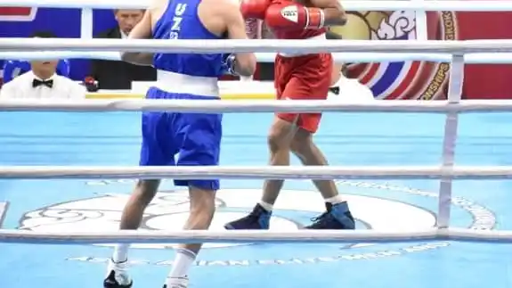 Kavinder Singh Bisht during action against Mirazizbek Mirzahalilov.